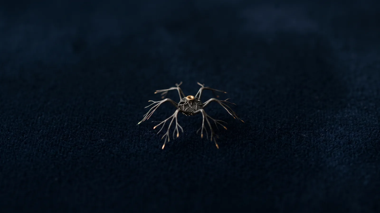 A tiny spider-like metal filter implant in extreme macro